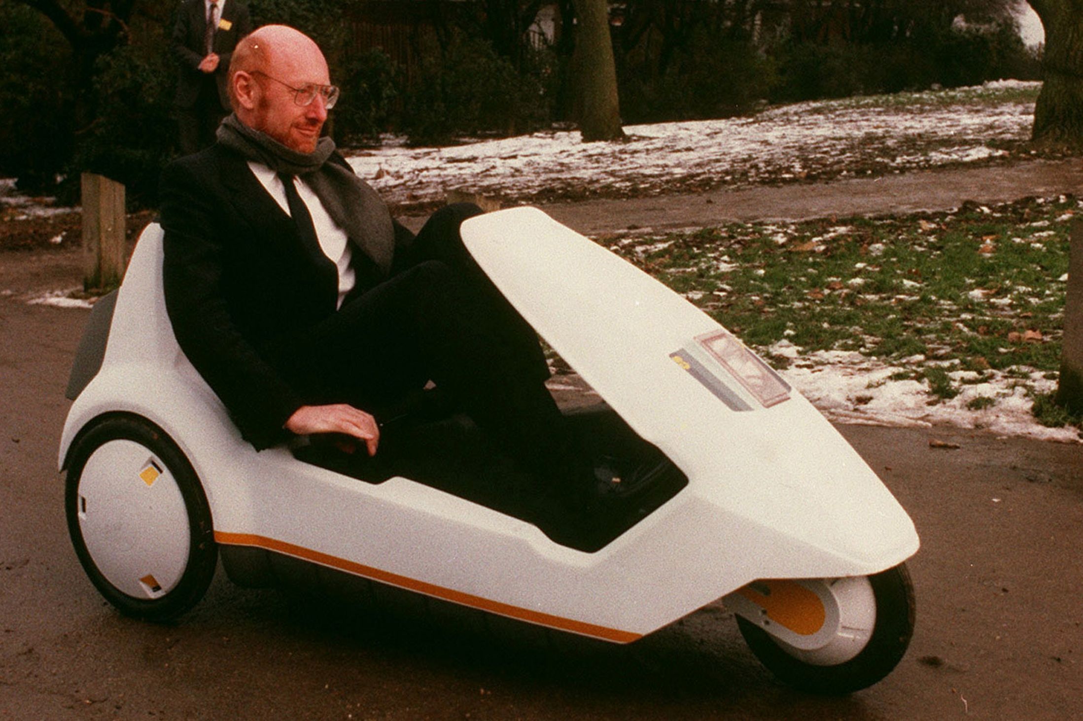 The Sinclair C5 with Clive Sinclair sat inside, the last nail in the coffin for Sinclair as a company